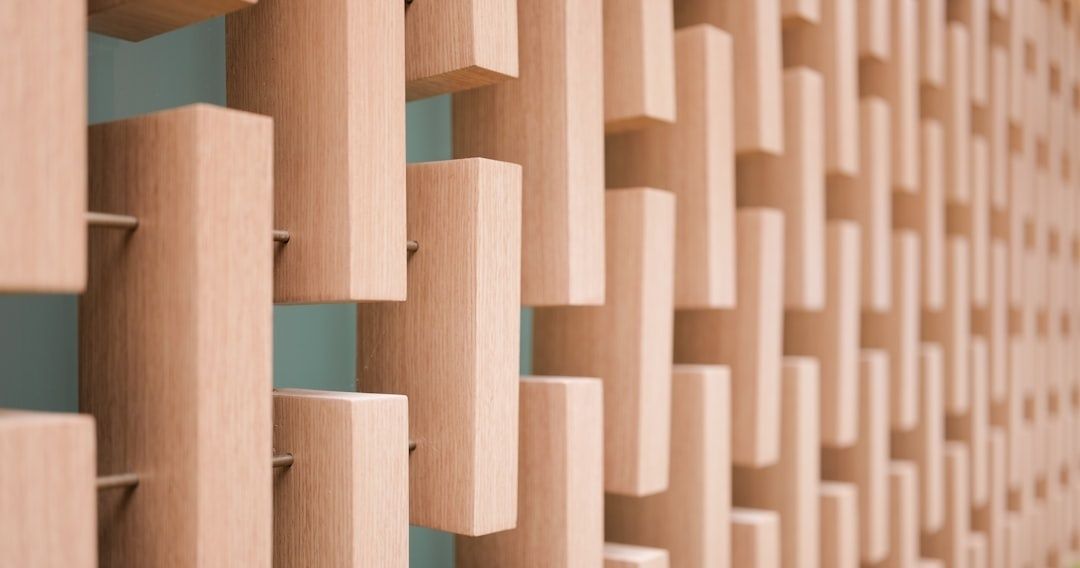 Close-up of a wooden acoustic diffuser wall with staggered blocks